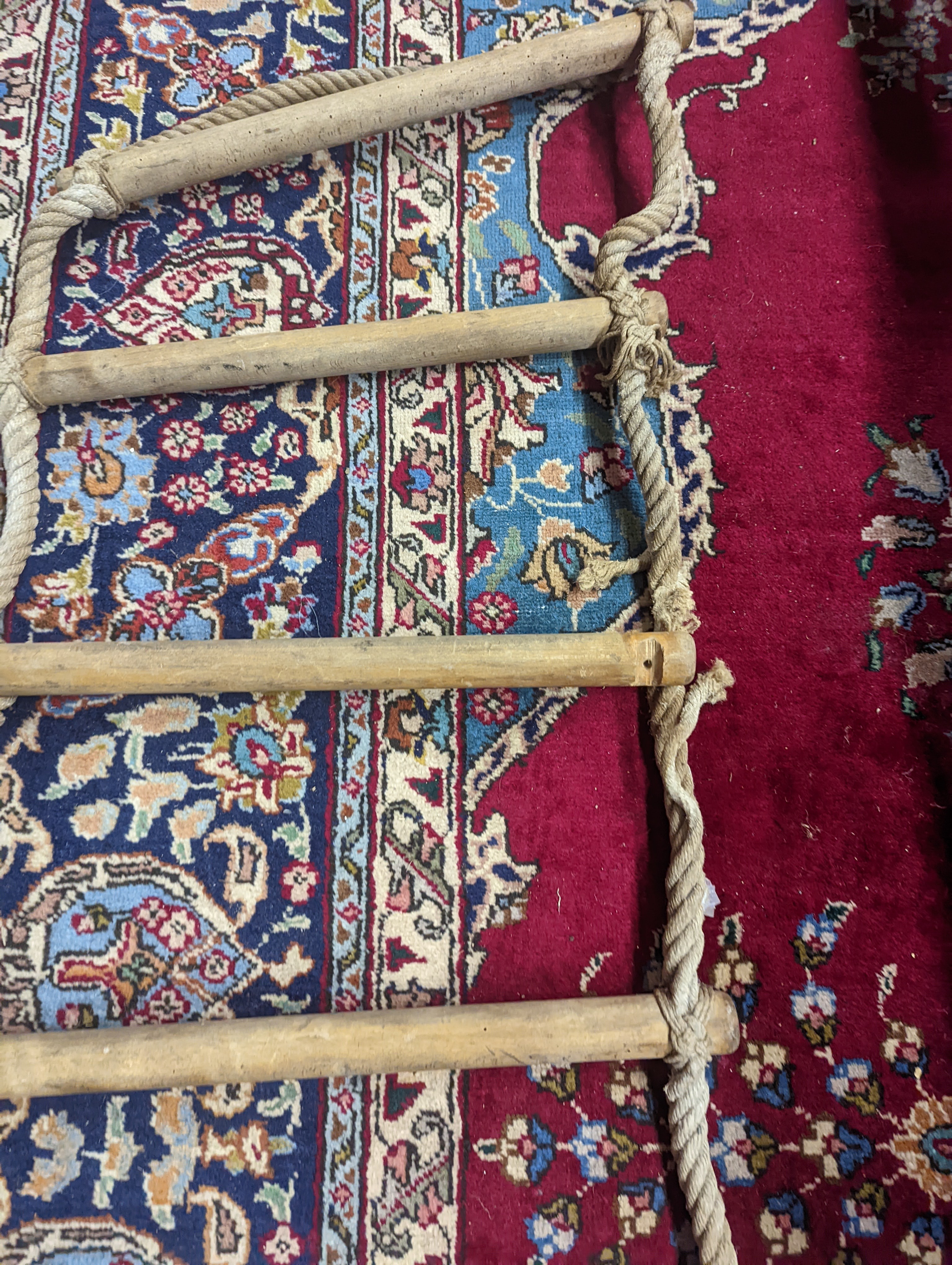 A rope ladder, Length 3.9 meters. (1 lower rung damaged)